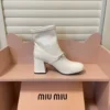Miu Miu Patent Leather Buckle Chain-Detail Ankle Boots