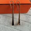 Hermes Polished Long Drop Earrings