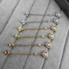 Messika Heart Tassel Stud Earrings