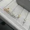 Messika Asymmetric Stud Earrings